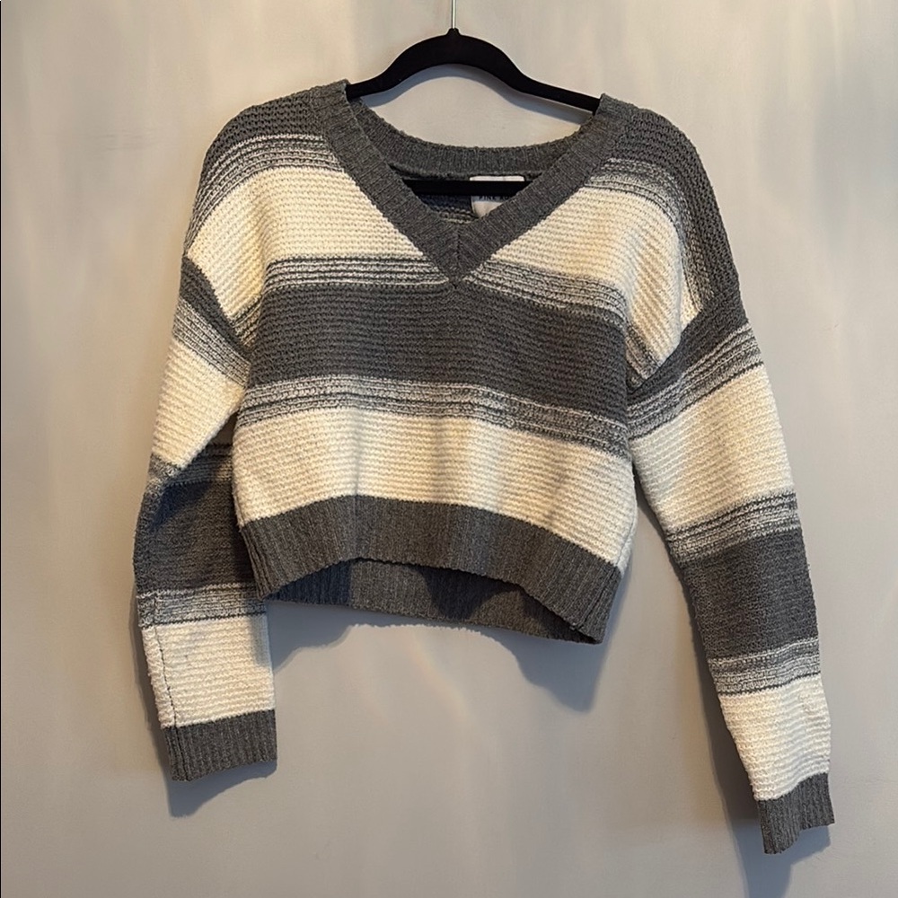 Gray and White V-Neck Sweater with Striped Design